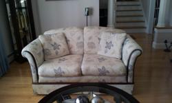Floral Roxton love seat in blue/beige colour. Perfect for a small apartment. Excellent condition