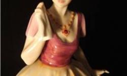 Royal Doulton HN3037 Miranda, designed by A. Hughes, stands 8.5" tall. Issued from 1987 to1990.  Book value is $325.
There is damage to the left hand (some of the fingers are missing) see pic.