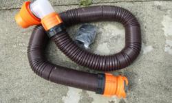 a 14 ft rino flex. sewer drain hose as new with extra connections 50.00