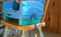 For Sale: Portable highchair, made to strap on and secure to regular kitchen chair. Acts like a booster seat to allow your child to comfortably eat at the table with everyone else. It fastens around the chair and underneath for stability. There are straps
