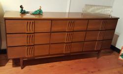 Mid century modern 9-drawer walnut dresser manufactured by VicArt. Nice solid retro detailing. Highboy chest of drawers and double headboard, foot board rails, and mirror also available. SPECIAL Buy the 9-drawer dresser and highboy chest of drawers and