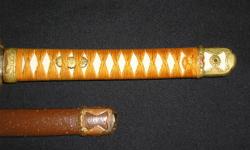 Sharpened Katana Samurai Sword, there is a signature on the tang.so I'm pretty sure it's a real Samurai sword, I don't know much about it so check out the pics and let me know if your interested, if you have any info on it please pass it on to me as it