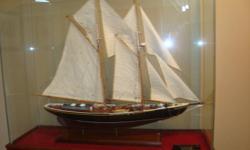 Scale model of the Bluenose11 tall ship incased in glass
 
size  14 inches deep,  47 inches wide,  39 inches high
 
first model built by George James , a Nova Scotian native.
 
Two of the following pictures are close up to try & show detail of the model.