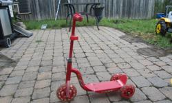 Red children's scooter. Excellent condition.