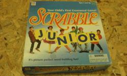 Scrabble Junior is for ages 5+ and can be played with 2 to 4 players. The game board is double sided, one side has words written on it so young players can match up the letters and players earn a point when words are completed, the second side is an open