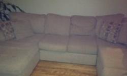 Super comphy large sectional for sale. Beige in colour, one attachment is a two person day lounger. The couch comes appart in 4 pieces. Couch was purchased 3 years ago from Leon's. Please reply if interested.