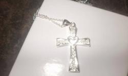 I have a cross necklace with a heart in the center of it...925 Silver.very nice necklace..brand new..Give me a offer