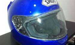 Shoei motorcycle helmet. Solid blue in colour. Size is "M" 7 1/8 - 7 1/4. Perfect condition, only used for approx 8000 km. Comes with clear and tinted visor. $400 OBO.