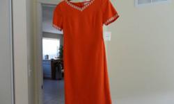 Size 8 Brand new dress with the tag still on it.   Shomi by Miller Shor lined orange silk dress with leaf stitching design around the neck and arms.  Never Worn.