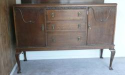 Sideboard made in Scotland. Solid wood, good condition, 3 drawers (dovetail joints), one shelf on each side. Not sure how old, but the furniture maker was in business from 1868 to 1990.
Can be viewed near Salmon Arm.