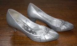 Silver heels with ruffled front edge for sale. These were worn only once, so they still look great! Bought at Spring, they are size 8/8.5 with a 1.5 inch heel.