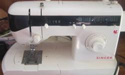 Singer sewing machine. Multiple stich paterns. Extra foot plates/guides/accessories. Very lightly used. Excellent working order. Manual included.