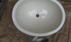 I have one new still in wrapper ivory colour sink. It's acrylic and is perfect to replace your worn out one in trailer, RV, cottage etc. Also comes with new stopper and mounting hardware 12X15 inch.