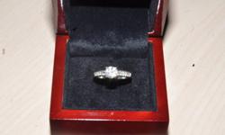 Size 7 18k white gold antique style engagement ring containing one .82ct round brilliant cut diamond in the center, G colour, VS2 clarity, very good cut. This ring also has 14, .03ct diamonds set on shoulders and face, F colour, VS2 clarity, also good