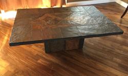 Slate coffee table for pickup. Nice table just had a small hole on the top. Open to any offers. Approximately 4ft long, 3ft wide