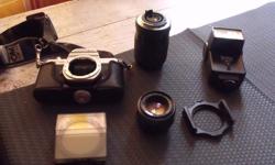 70-210mm Vivitar lens
1:2 50mm lens
Vivitar Flash
2 Cokin filters
K1000 Pentex camera (may need repairs)
Camera Bag