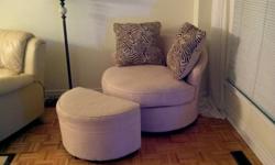 Selling my small couch with leg rest. Its in great condition and almost new. The reason why i am selling it is because it didn't fit our living room design. The couch can also spin and comes with 2 pillows as seen in the picture. E-Mail for more info!