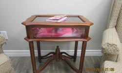 Small wooden display cabinet with glass hinged top, glass sides and inside rear mirror. Like new condition!!