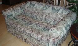 Sofa and matching loveseat for sale.  Light multi-coloured fabric.