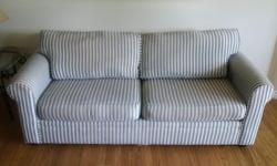 Bauhaus denim blue and white striped sofa bed. This sofa is 75/76 inches long from arm to arm and 36 inches wide. It is comfortable as a sofa and also doubles as a pull out double wide bed.
A great sofa/hide a bed for a suite or a student.
From a non