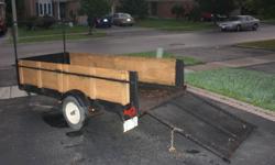 TRAILER CAN CARRY UP TO 2000 LBS. HAS REMOVABLE SIDES AND HEAVY DUTY REAR RAMP. ALSO HAS RACK AT THE TOP FOR CARRYING CANOE OR LONGER LOADS. I'VE CARRIED 20 FT LUMBER. FLOOR IS STEEL CHECKER PLATE. GREAT LITTLE TRAILER. LIGHTS WORK AND LEAF SPRINGS IN