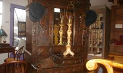 I have a solid oak English Hall Stand for sale. It is in excellent conditon and dates to circa 1880.
  It has carved dragon or gryphon decoration, brass coat and hat hooks and the original metal drip pans for umbrellas and walking sticks.
 It measures 76