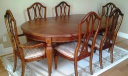 Stanley Sloane Square Solid Cherry Wood Dining Table and 6 Cherry Wood Chairs. Table has 2 extra leafs. Original price $3995.00 purchased in Vancouver from Monarch Furniture Gallery. Asking $1500.00 OBO Purchased in 1996. Have original paper work receipts