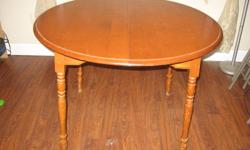 Round table with two inserts to extend table.  Can use just one leaf or both depending on the size of table you want.
Table is sturdy and in good shape, some scratches on top. 
Maple wood