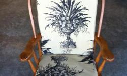 Solid Maple rocking chair with cushions; in excellent condition.