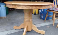 Beautiful solid oak DR Table and 4 chairs.
Table is 42" round or a 60" oval with the leaf.