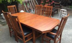 Amazing!! Canadian made solid oak dinning room table and chairs....pull out leaf, leather seat cushions and its in like new condition!