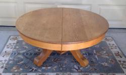 Solid oak round table cut down to coffee table height. 42 inches in diameter, 20 inches high. $200 OBO.