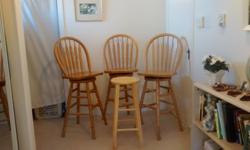 Set of three, with backs and one regular stool.