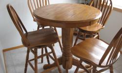 Solid Oak Table & Chair Set
This set is in flawless condition as it was hardly used
No Scratches,  Two years old,
Comes from a custom built home,
The four chairs swivel,   All Solid Oak
Measurements  41" from floor & 36" wide
Must See  reg 1,500.00
