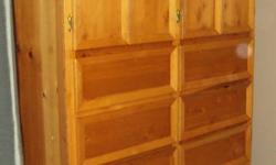 Custom Made Solid Pine Armoire
 
 Excellent Craftsmanship!
 
6 Deep Drawers
2 Cupboard Openings
2 Shelves
 
Can Be Used As An Armoire For Clothes Storage, Crafts & Games, Or Even A Kitchen Pantry! 
 
$150.00 O.B.O 
 
Other Household Items For Sale!
 
Call