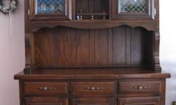 We've purchased a larger set and now need to sell our beautiful solid pine dining room set.  It's been lightly used and is still in excellent condition. The hutch and buffet measure 72 inches high by 50 inches wide.  The table comes with 4 chairs, all