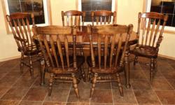 Oval Pine table, 64" L X 48" W. Four Pine side chairs & 2 armchairs. 2 large leaves, each 20" Wide. Table will extend to 104" seating 10 easily, 12 to 14 can be seated. Nice condition with only a few minor marks from everyday use. Suit farmhouse style