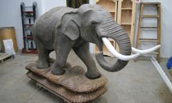 This one of a kind showpiece will become a conversation piece in any foyer or enterance indoor or outdoor. It was handcarved from one solid piece of teak in Indonesia, costing $8000 to make and ship here. This elephant stands approximately 4.5 ft high and