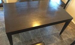 Solid wood kitchen table Espresso in Color. Table is 29 inch high X 35.5 inch wide X 59 inch length. No leaf in table. Comes with two navy blue chairs (not shown). Asking $200 OBO. Please call or text 306-551-3333 or by email.