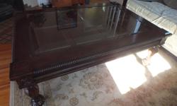 Up for sale is this very nice glass top over solid wood coffee table ,it is in good condition with a couple of minor marks which is common . but it does not take away from its looks . The size of the table is 40 inches width and 58 inches long and 20