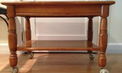 Solid maple tv stand, wheeled. Good condition. 25" x 18", 15" high.
