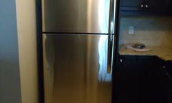 STAINLESS STEEL GE REFRIGERATOR.  bought in 2008 LIKE NEW. Spotless & clean not a scratch. 66 1/8" HIGH 29 1/2" WIDE 30 1/4 DEEP.