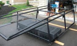 Selling super heavy duty roof racks extended over-cab roof for an 8 foot box chevy silverado. Black painted, round heavy duty pipes. I will also include the tool box for free. Contact if interested.