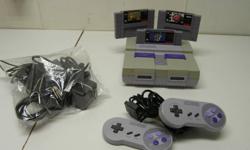 Working Super NES with 2 controllers, and all the wires for hook up. Comes with Super Mario World, The Lost Vikings, and NBA Jam