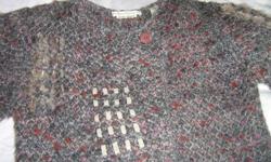 Hand loomed by Nancy Bossio.  Size small.grey (with some purple and burgundy).  68% arcylic, 15% wool 9% polyester, 9% nylon.  Has patches of fur.  One button at top left.