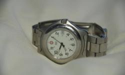 Used Swiss Army wristwatch with about 65% condition, nothing that can't be buffed out by any stainless steel watch cleaning professional. Otherwise in very good condition, just needs a polish. Great watch, waterproof 100m and quartz!