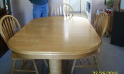Light wood table and 6 chairs, all in excellent condition. The table is 5' x 3Â½ ft and with the extension in the centre extends to 7 ft.