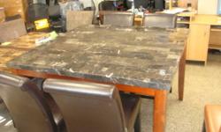 Brand new  54" x 54" Marble Table  that is counter height with 4 brand new bonded leather counter height chairs. only 599 complete, compare at 1400+ Additional chairs also available Wood Table and 4 wood chairs only 349 compare at 700+ Dark Brown table