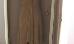 Tan Dress from David's Bridal, Size 8, never altered. Worn once for a few hours. Will through in matching shoes for free if your a size 8 shoe. Dress length falls under the knee. Will deliver and will make deals with my other ads. Thanks for looking.