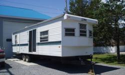 Super clean park model trailer, 35' 1 bed front kitchen, furniture, appliances, air conditioning, patio slide, hot water, furnace, propane gas test, filled tanks. Contact mike in sales. DELIVERY AND SET UP AVAILABLE!!